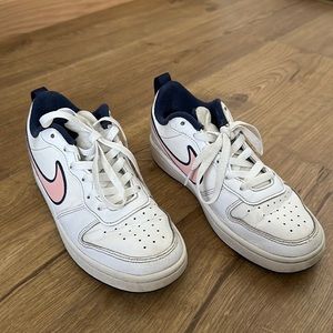 Girl white Nike shoes